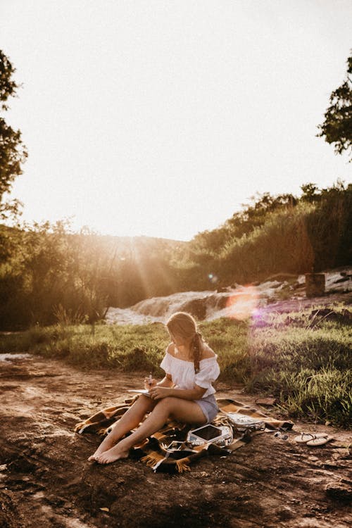 Free Photo Of Woman Sitting On The Ground Stock Photo