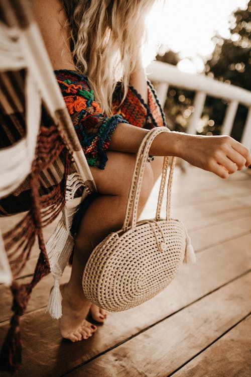 Woman Sitting on Chair in Patio