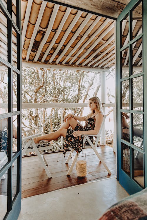 Photo Of Woman Sitting On Chair