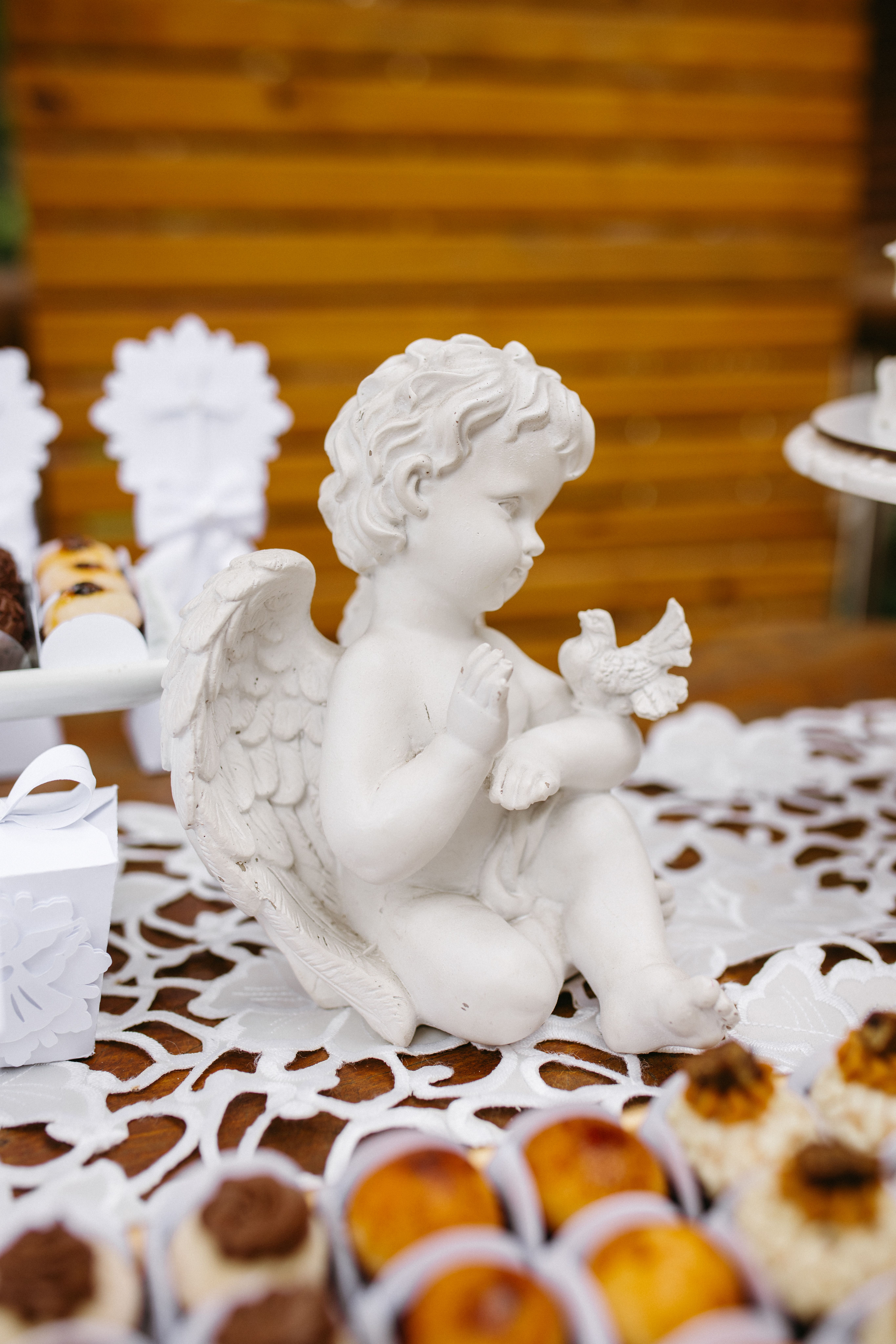 Charming White Angel Figurine on Dessert Table · Free Stock Photo