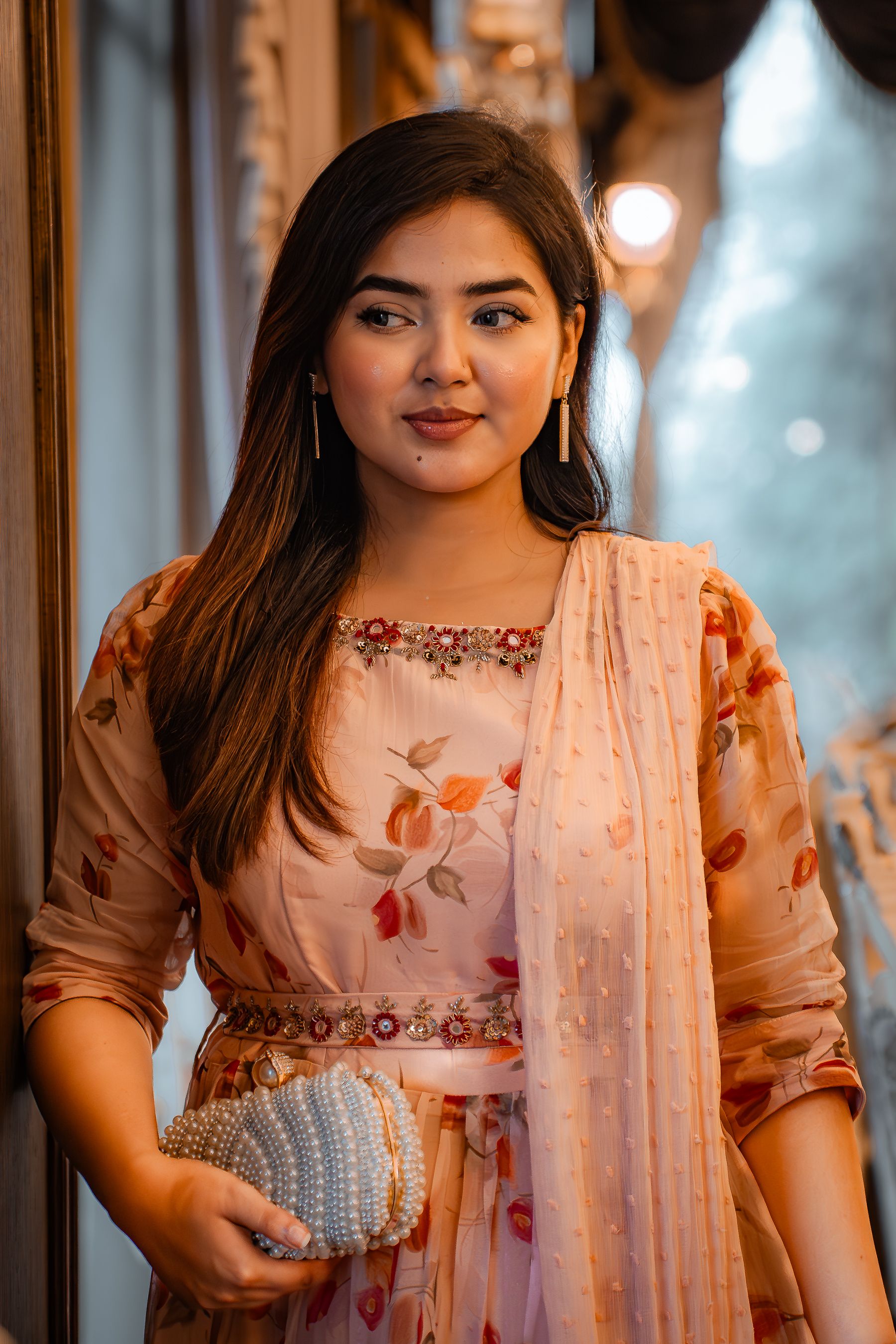 Elegant Woman in Traditional Floral Dress Indoors · Free Stock Photo