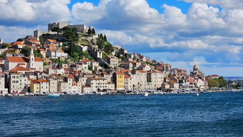 Free Panoramic view of Šibenik, Croatia with stone houses and blue Adriatic Sea. Stock Photo