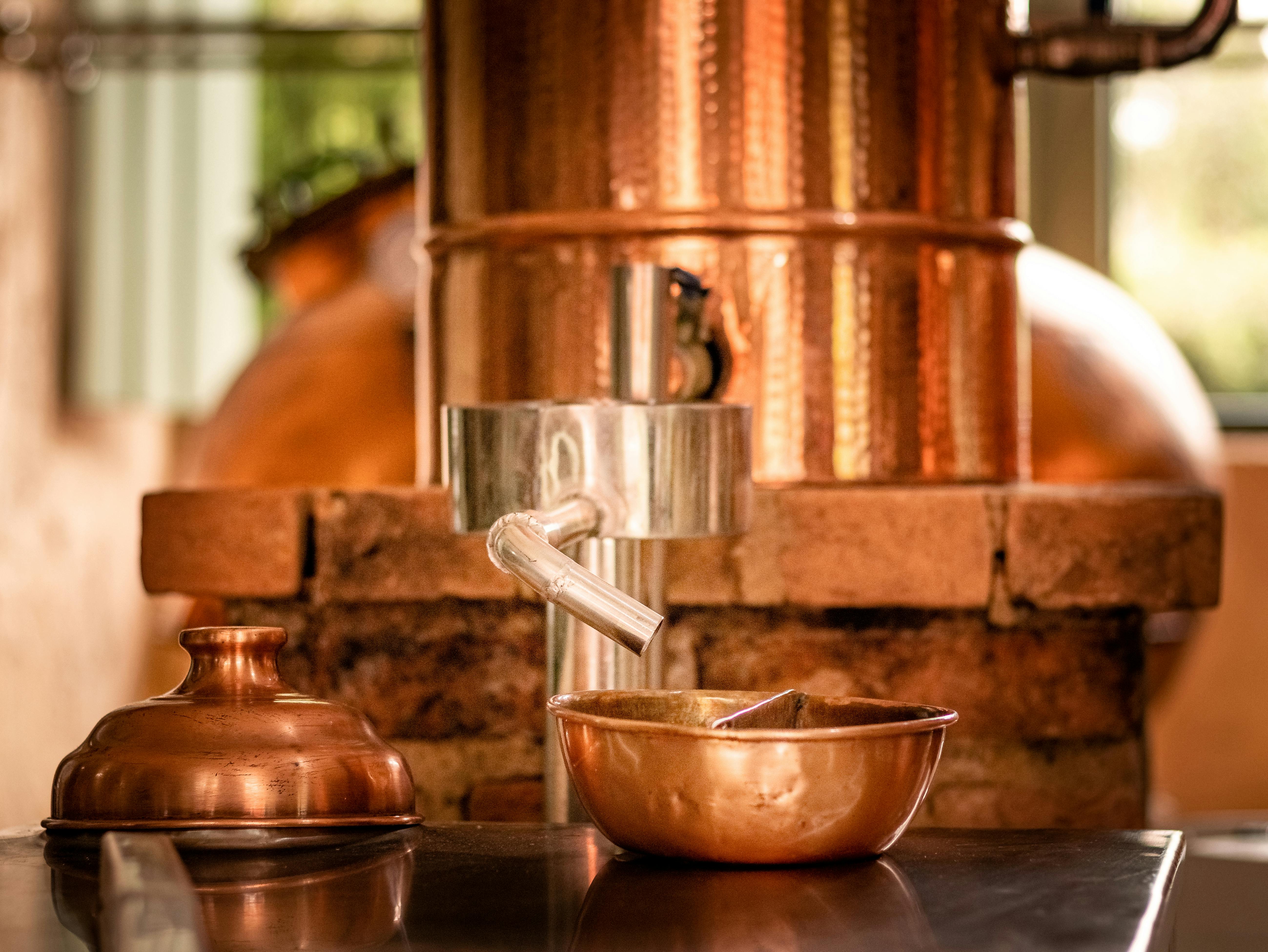 gleaming copper distillation equipment - natural vodka