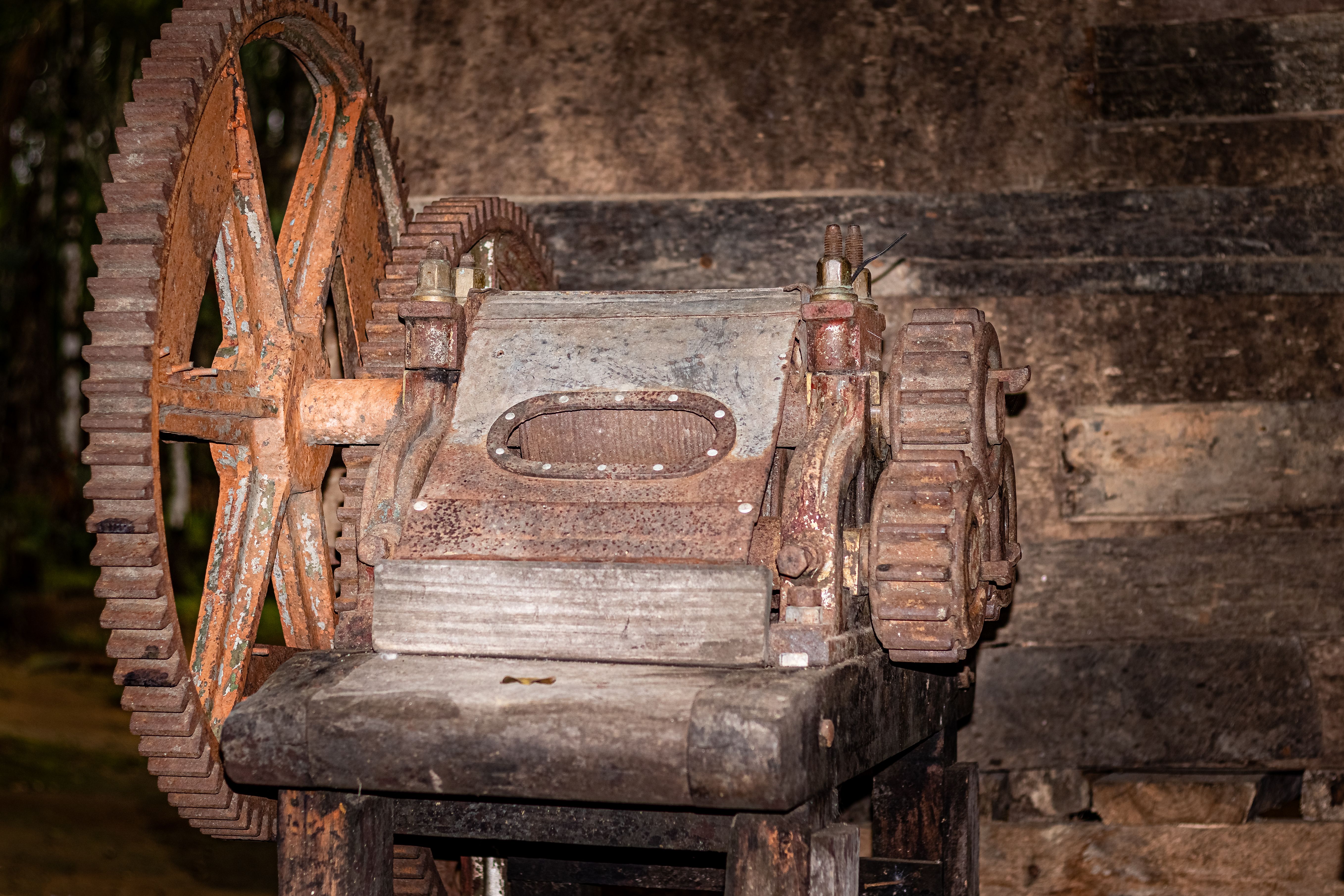 Vintage industrial machine with large gears awaiting removal