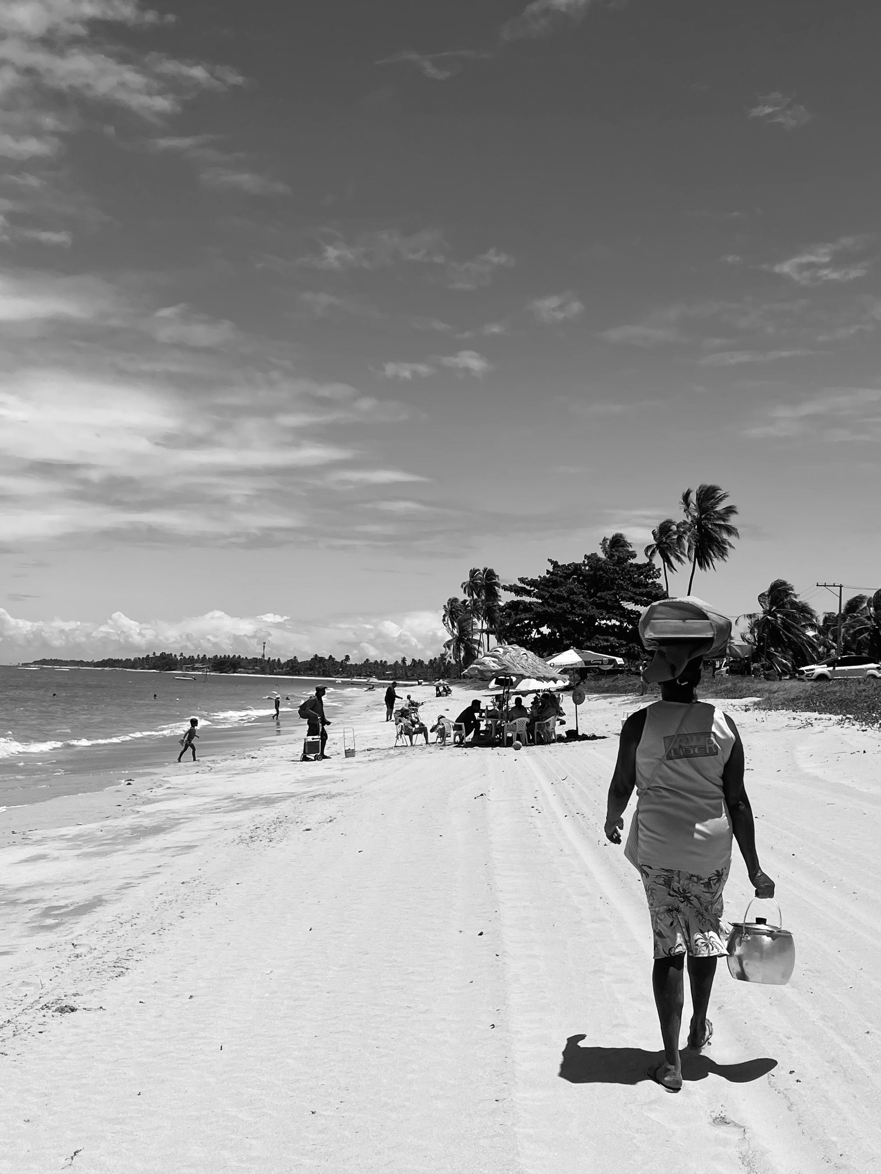 Black and White Beach Scene with Figures · Free Stock Photo