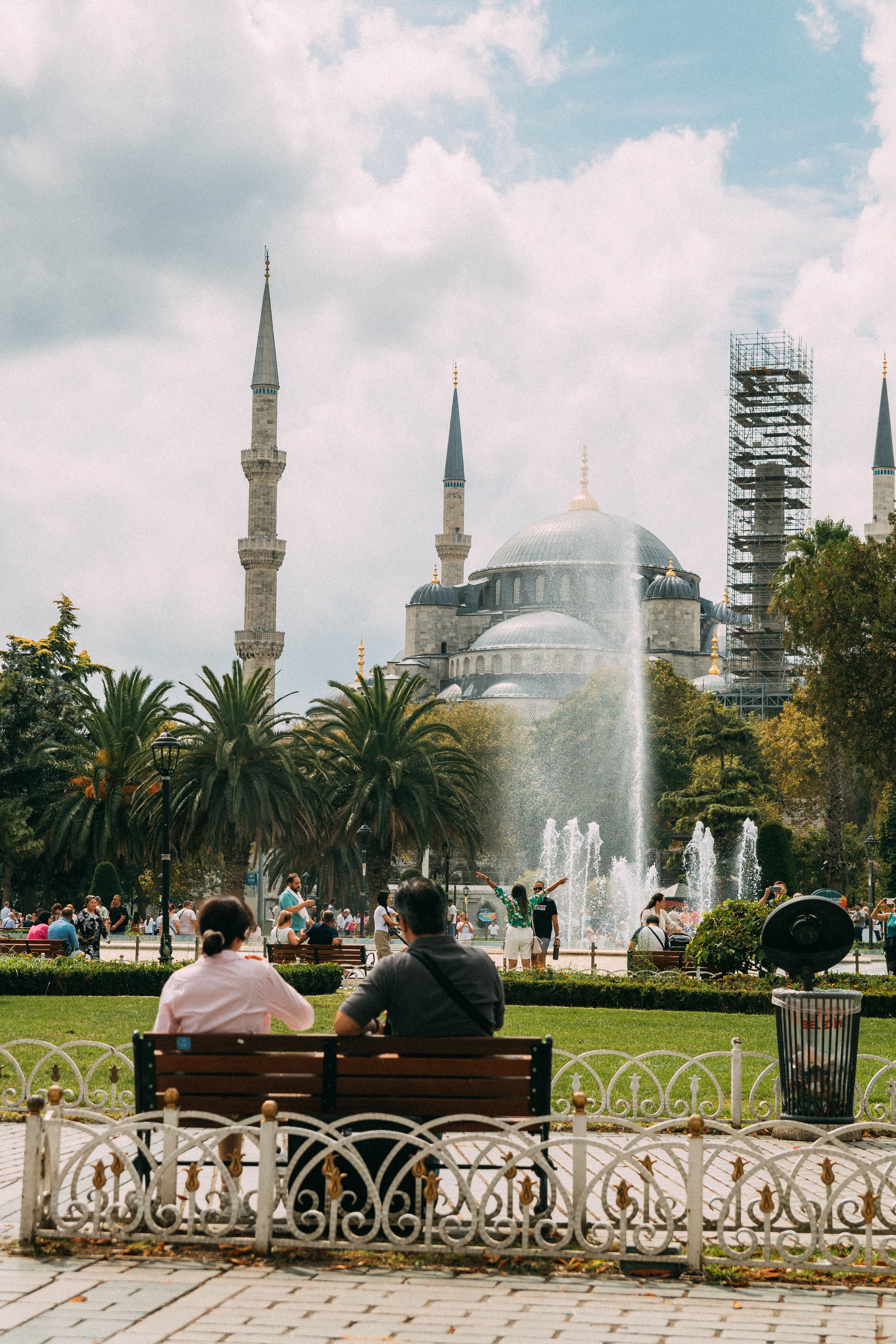 Couple Relaxing Near Blue Mosque Fountain in Istanbul · Free Stock Photo