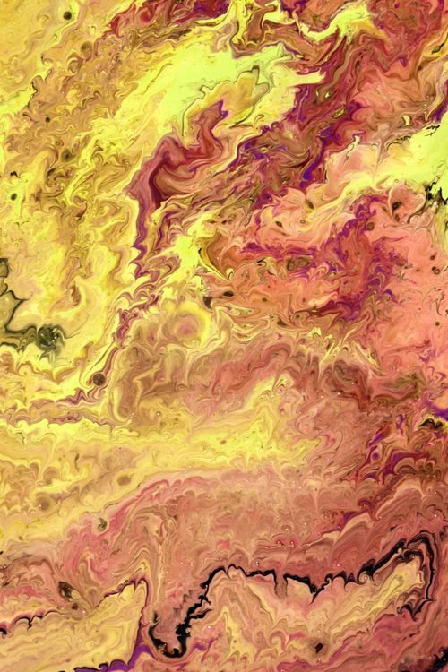 Free Dynamic abstract art featuring swirling patterns in vivid yellow and orange tones. Stock Photo