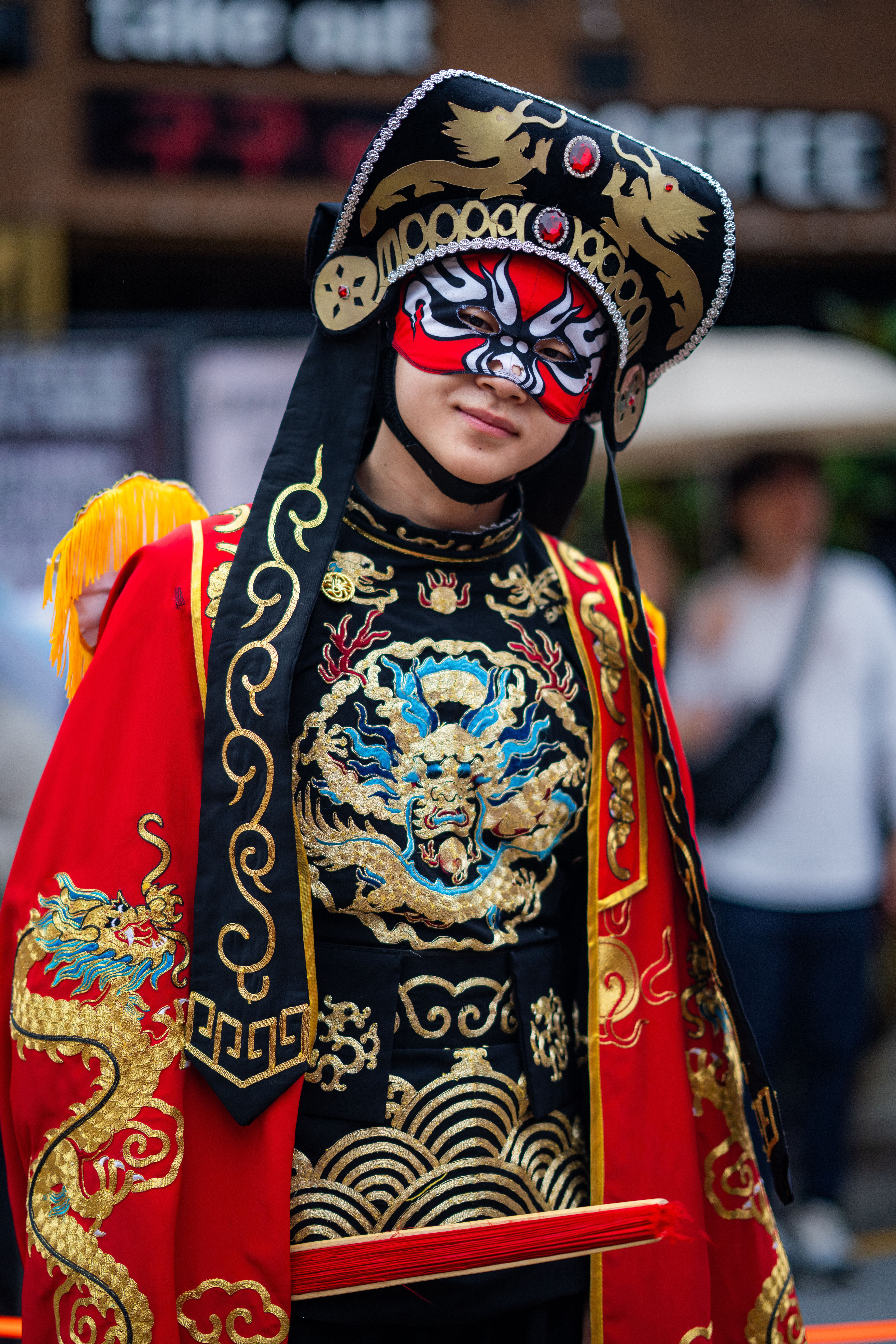 Colorful traditional Chinese opera costume with intricate embroidery and mask.