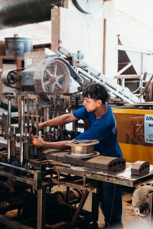 Industrial worker maintaining factory machinery
