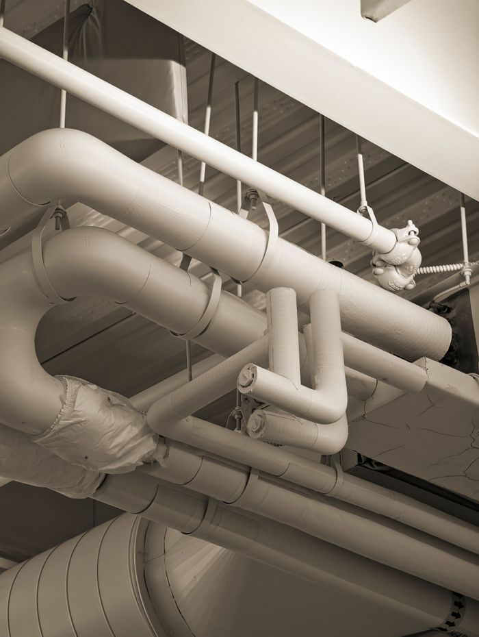Underground plumbing pipe network inspected during drain cleaning service