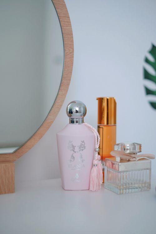 Free Elegant vanity arrangement with perfumes and cosmetics on display. Stock Photo