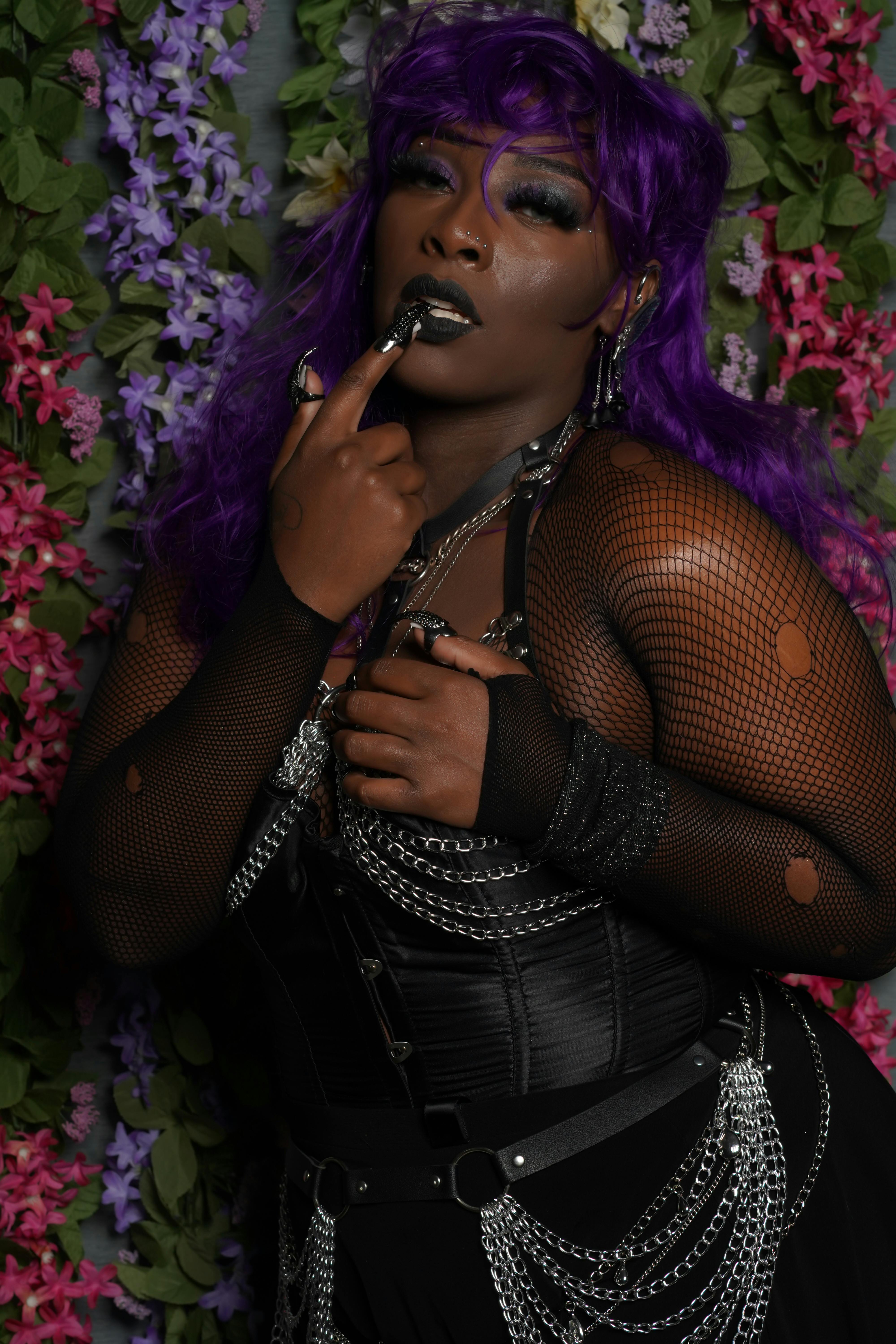 gothic fashion portrait with floral backdrop