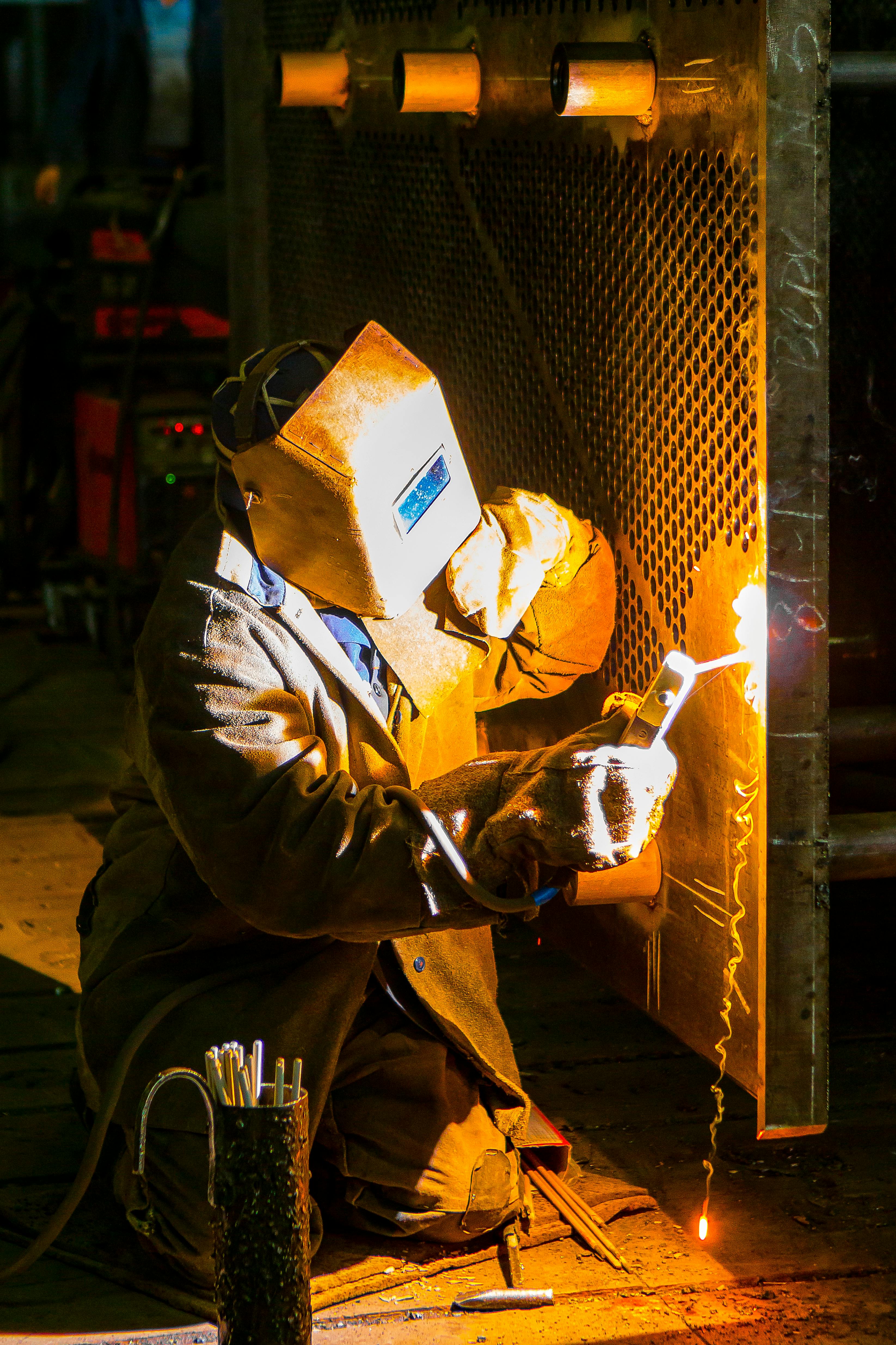 man welding metal