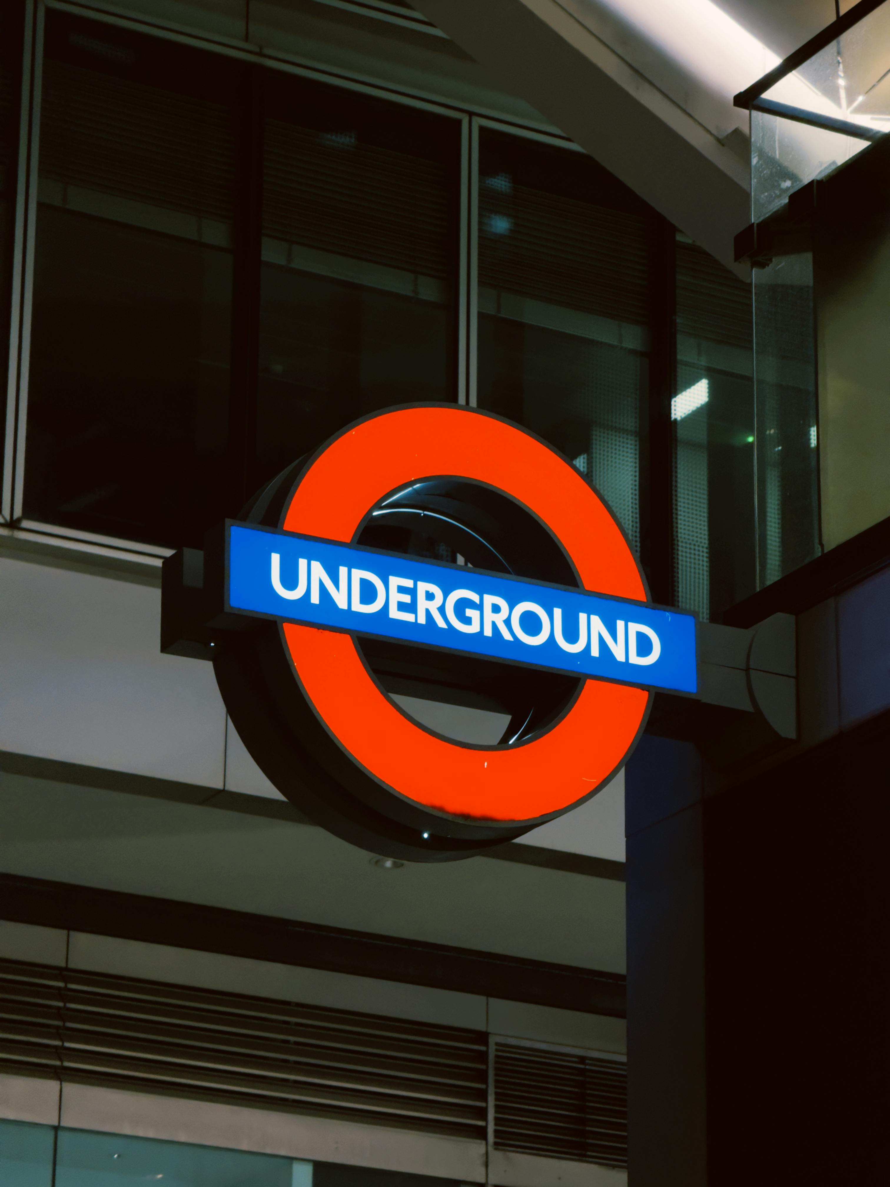 iconic london underground station sign at night