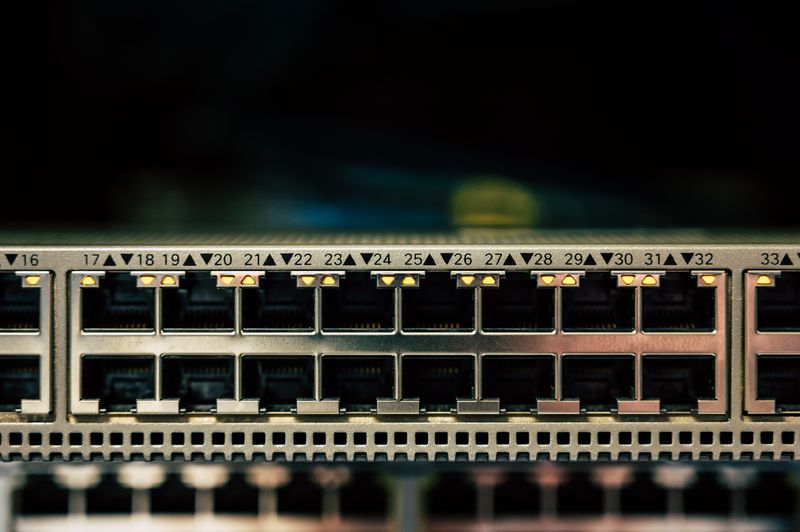 IT engineer testing Ethernet ports during a network installation
