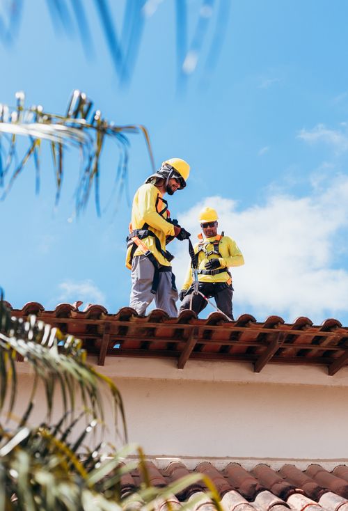 Copperline crew sealing roof vents and flashing
