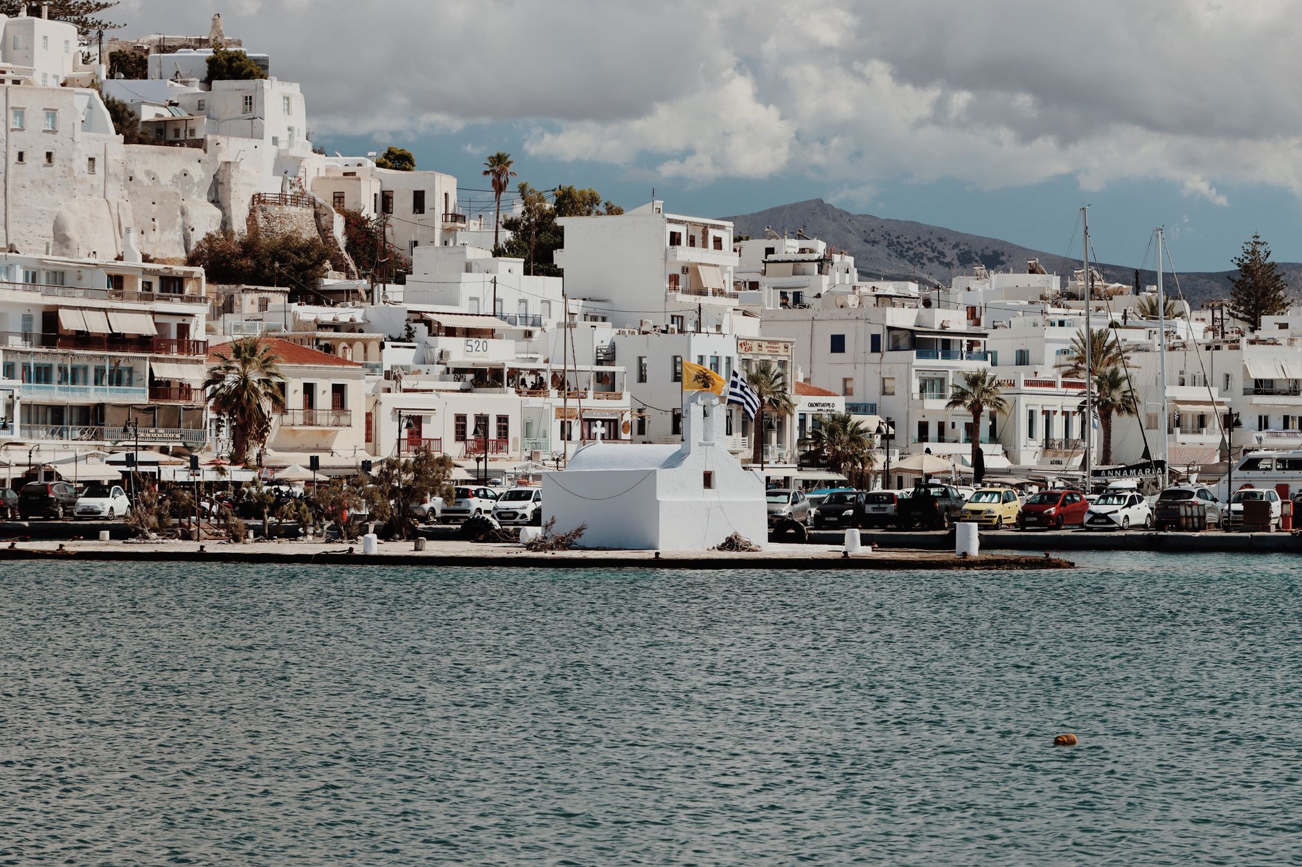 Discover traditional Aegean architecture along the stunning Naxos coastline in Greece.