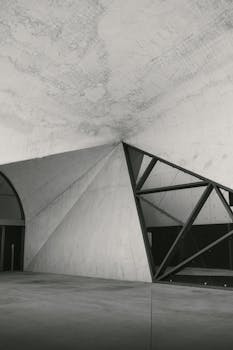 Explore a unique geometric concrete structure with artistic architectural aesthetics.