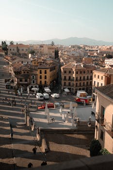 Aerial view of historic Segovia's architecture and streets during daytime.