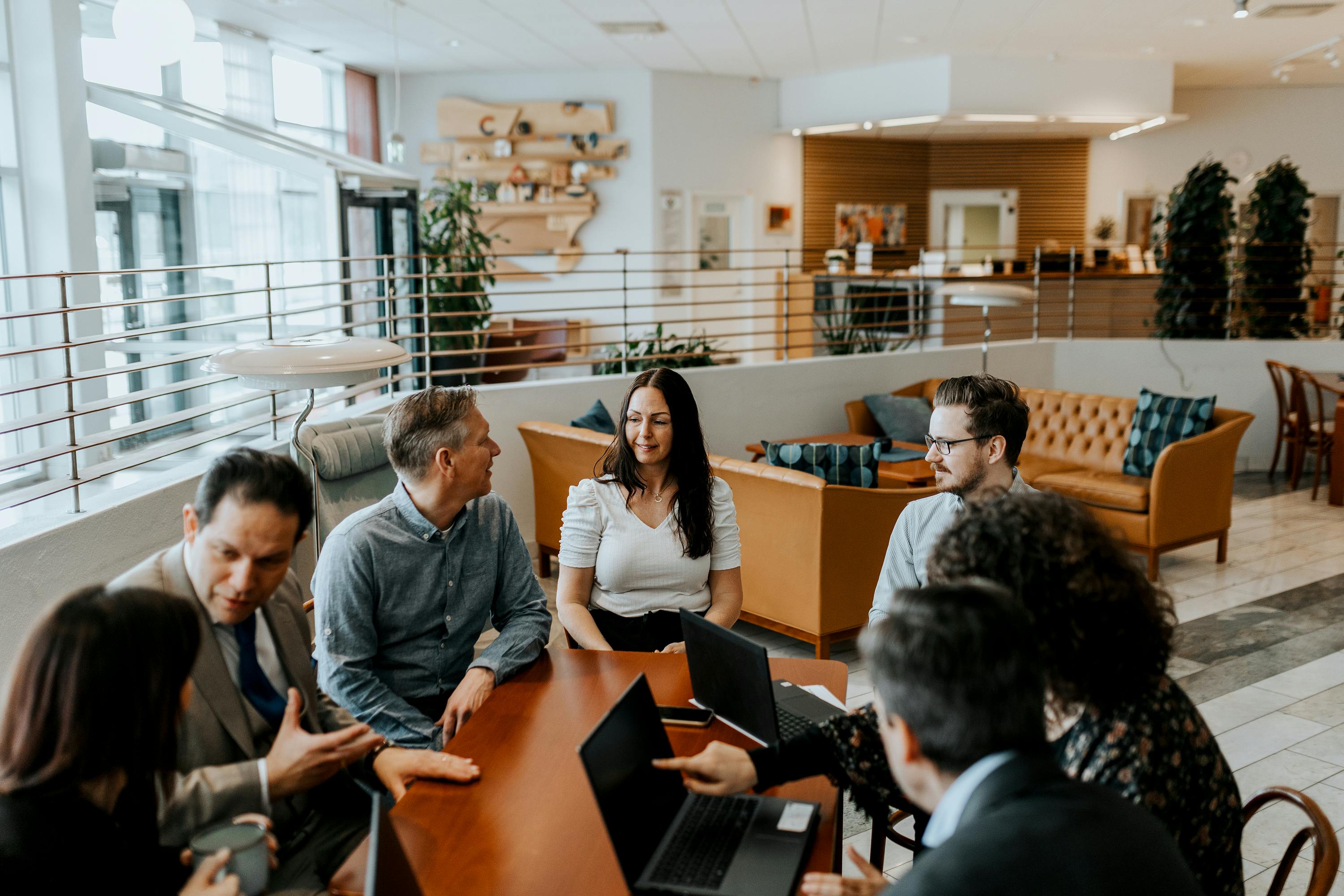 A group of people having a meeting in the office
