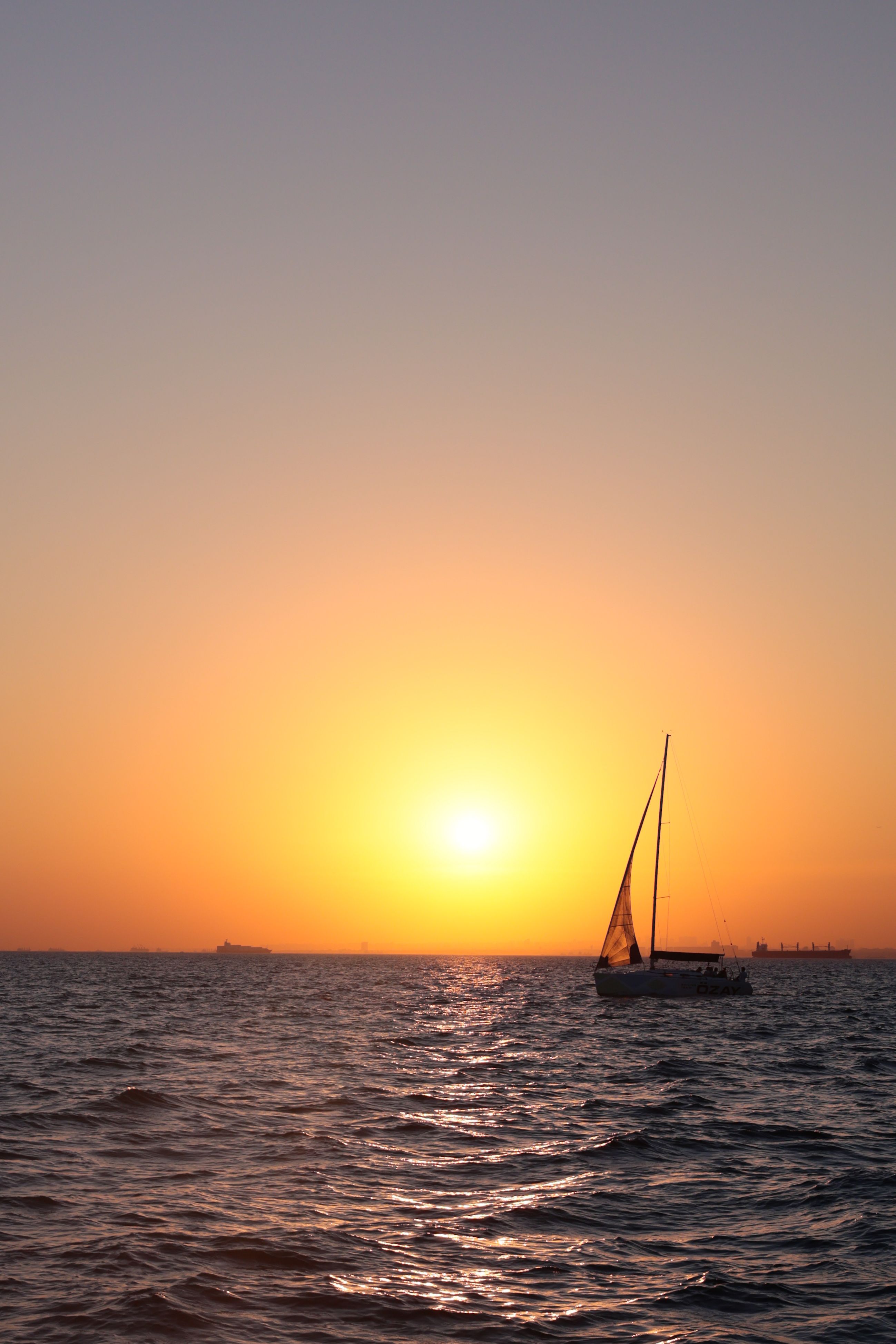 Sailboat on Body of Water during Sunset · Free Stock Photo