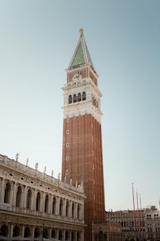 Elegant view of St. Mark's Campanile in Venice under a clear blue sky.