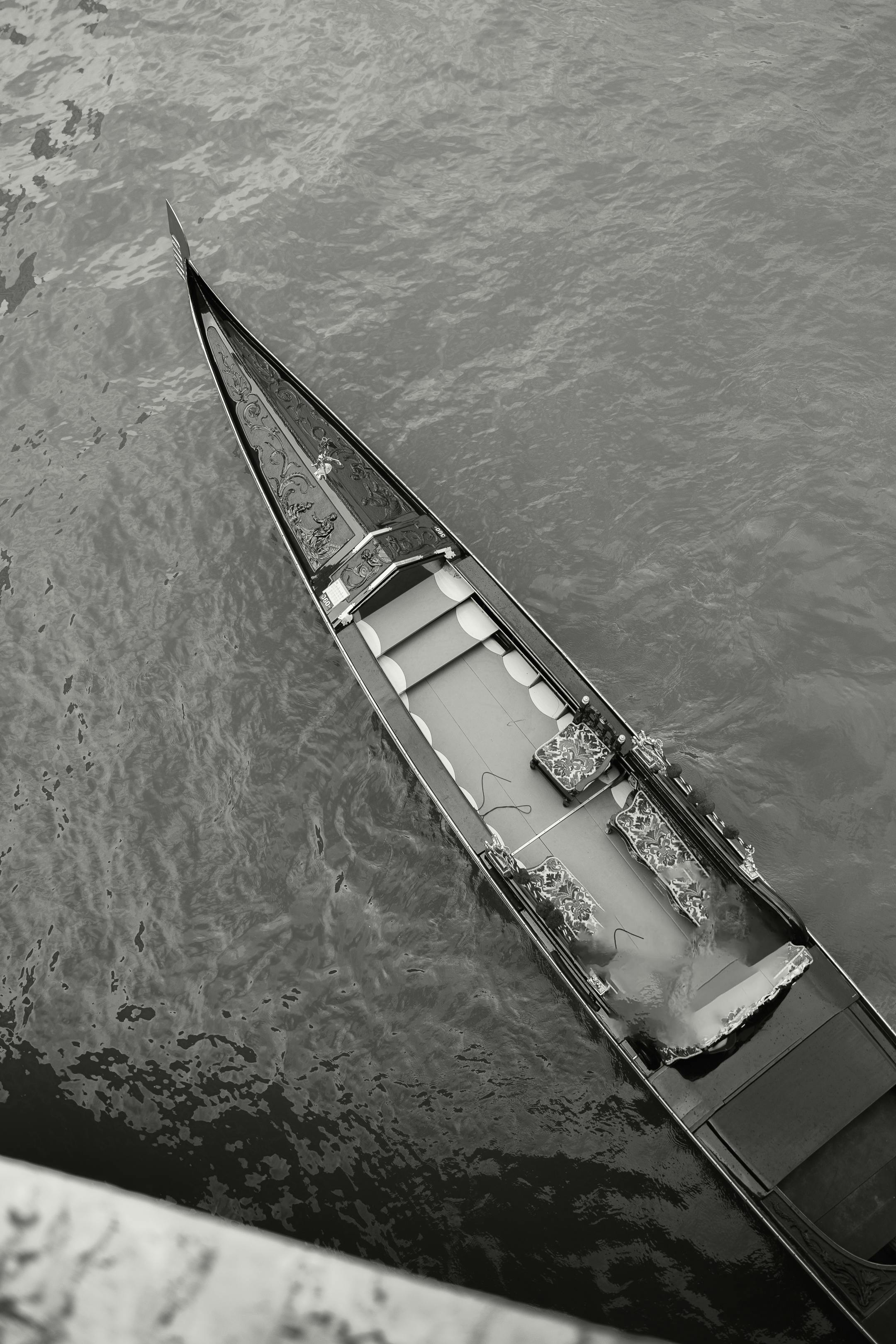 aerial view of empty venetian gondola on water