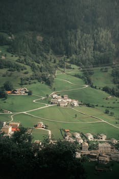 A serene aerial shot showcasing the lush landscapes of Saint Moritz, Switzerland.
