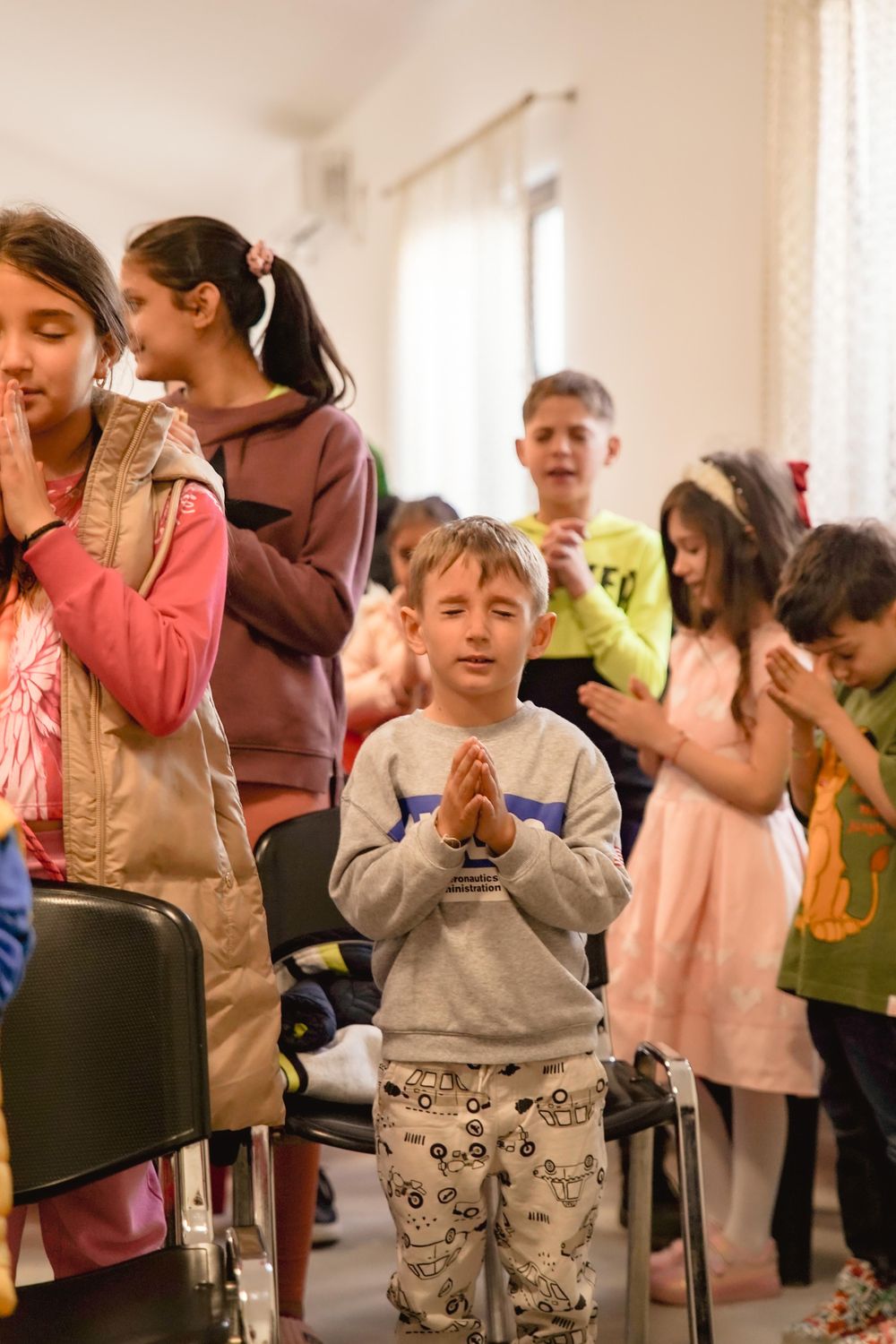 Children laughing and playing together in kids ministry