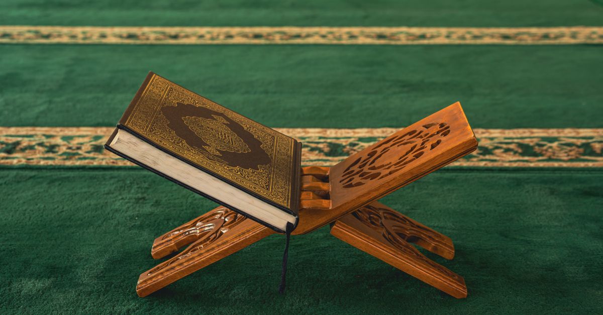 Qur'an on Wooden Stand in a Mosque Interior · Free Stock Photo
