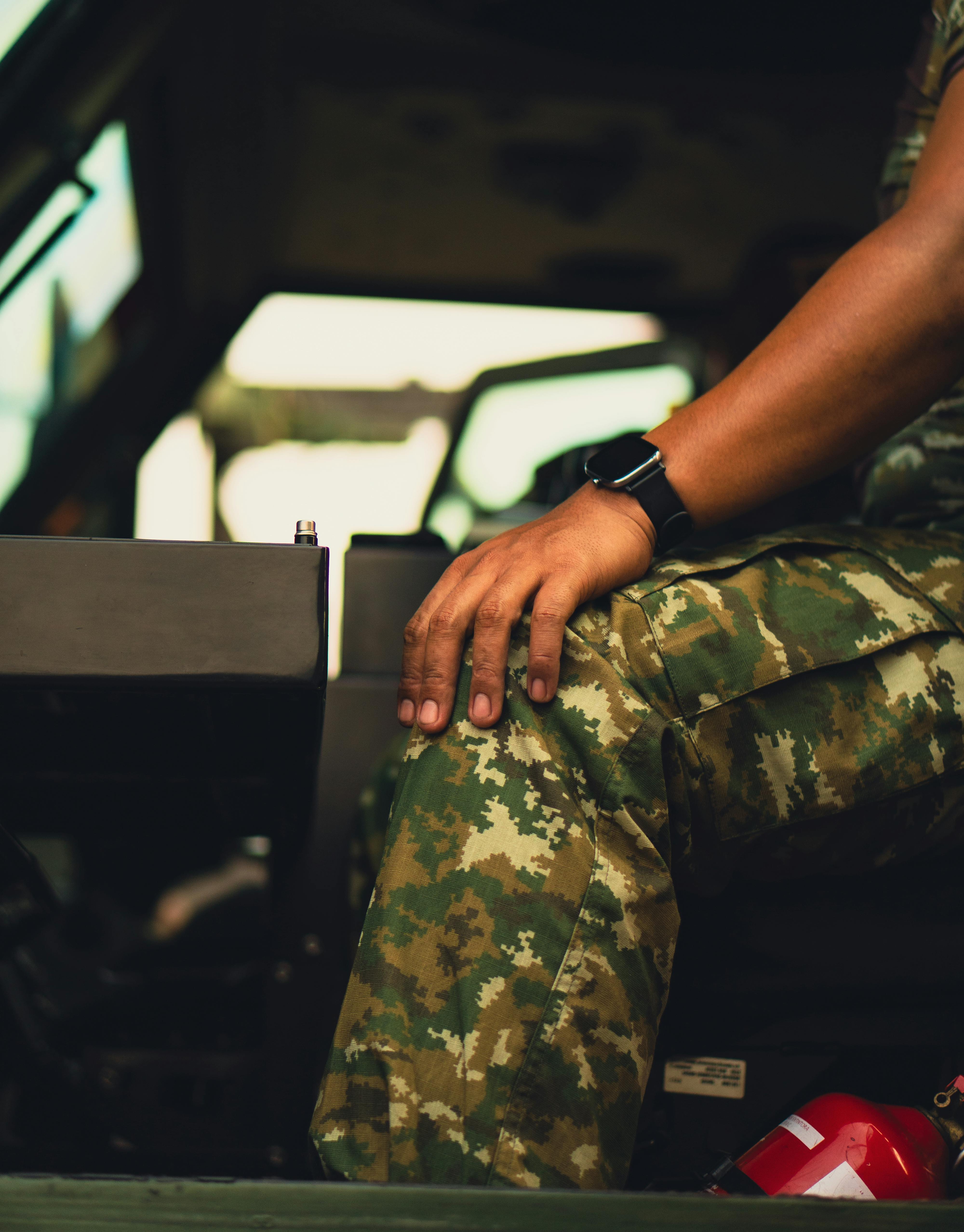 U.S. Army Veteran proudly showcasing his collection of military and dive watches, reflecting the personal journey from service to horological passion