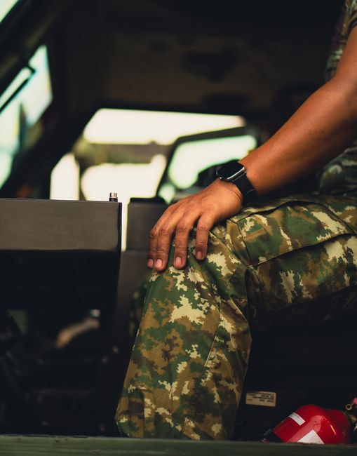 U.S. Army Veteran proudly showcasing his collection of military and dive watches, reflecting the personal journey from service to horological passion