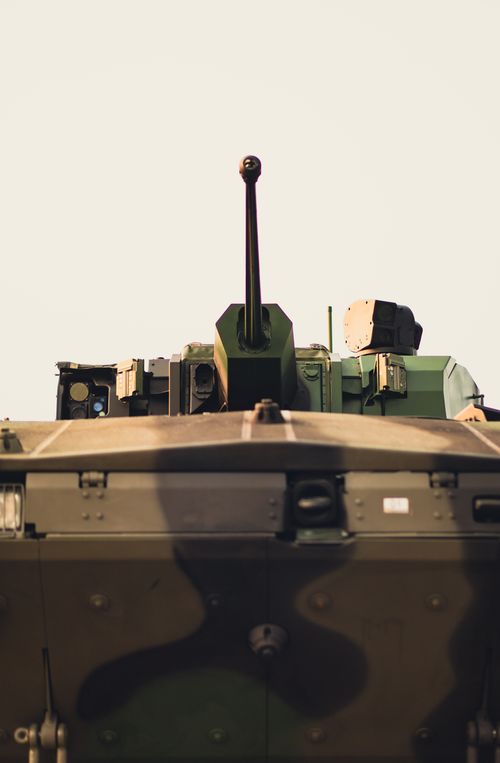 Free Close-up of a military armored vehicle showcasing advanced weaponry. Stock Photo