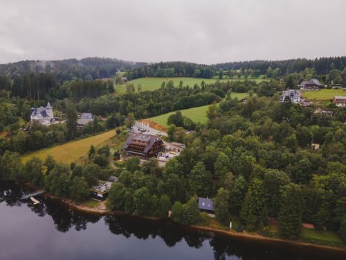 Free A breathtaking aerial view over Titisee Lake and lush landscapes in Germany's Black Forest region. Stock Photo
