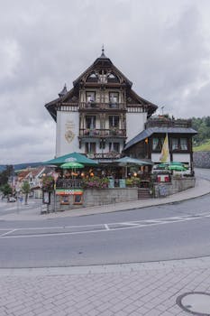 Picturesque traditional German hotel architecture in rural Black Forest setting.