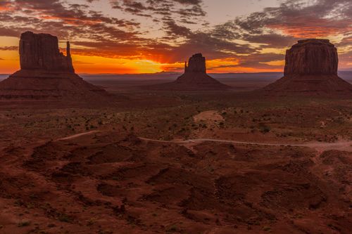 Free Capture the breathtaking view of Monument Valley's buttes at sunrise with dramatic skies and vibrant colors. Stock Photo