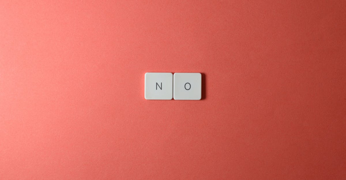 Keyboard keys spelling 'NO' on a vibrant red background in a minimalist composition.