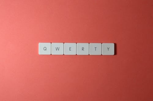 Free Close-Up Shot of Keys on a Red Surface Stock Photo