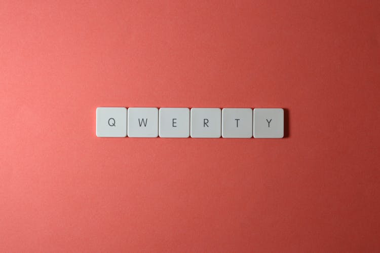 Close-Up Shot Of Keys On A Red Surface