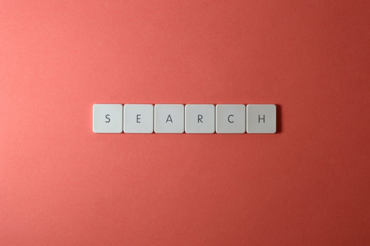 Close-Up Shot Of Keys On A Red Surface