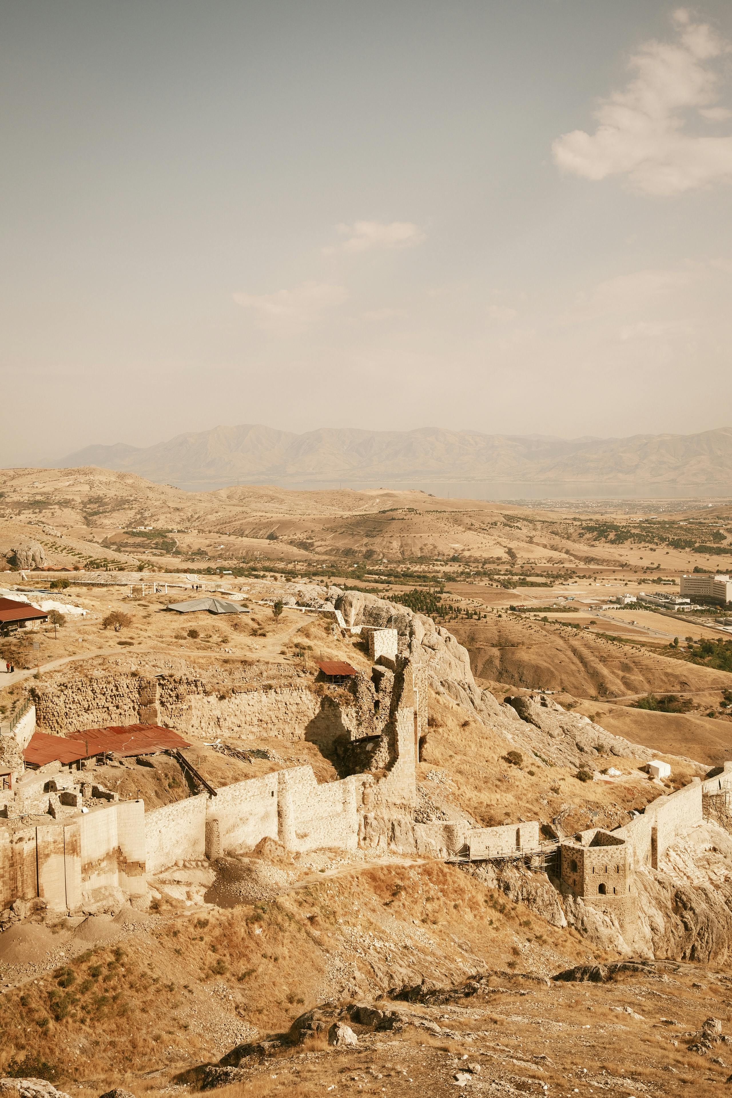 historic fortress ruins in rugged mountain landscape