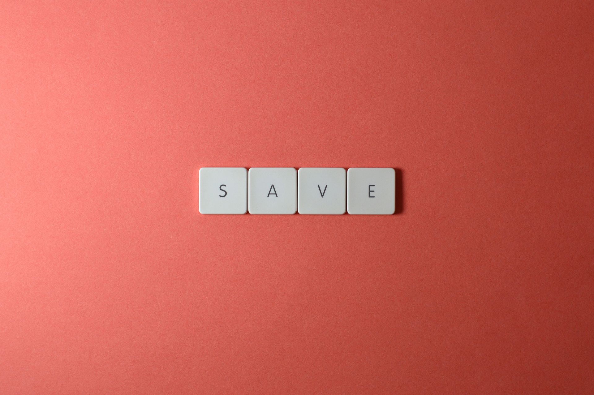 Close-Up Shot of Keys on a Red Surface