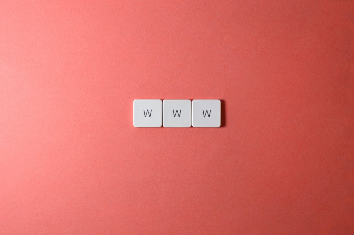 Close-Up Shot of Keys on a Red Surface