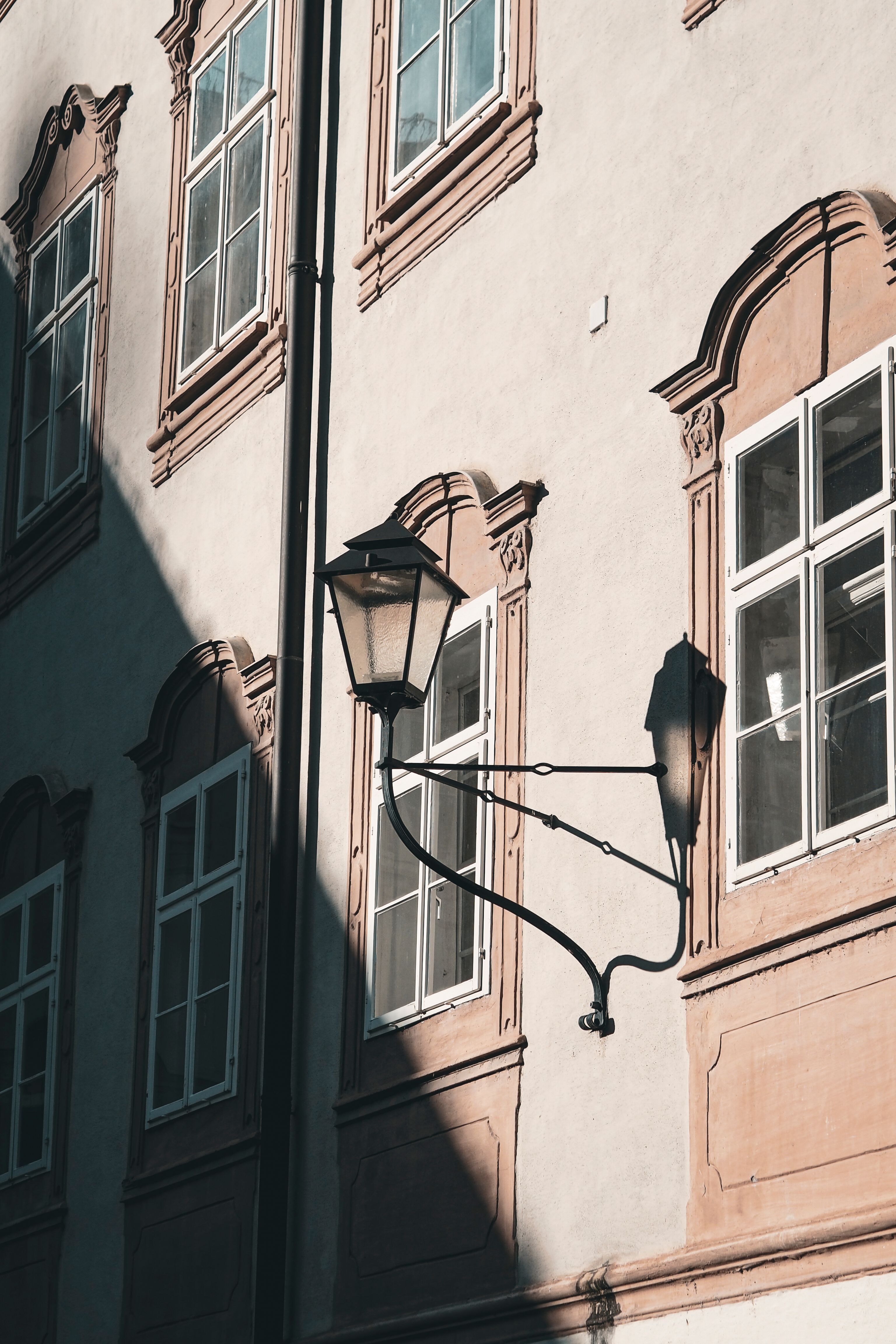 Elegant Historical Building Facade with Shadow Play · Free Stock Photo