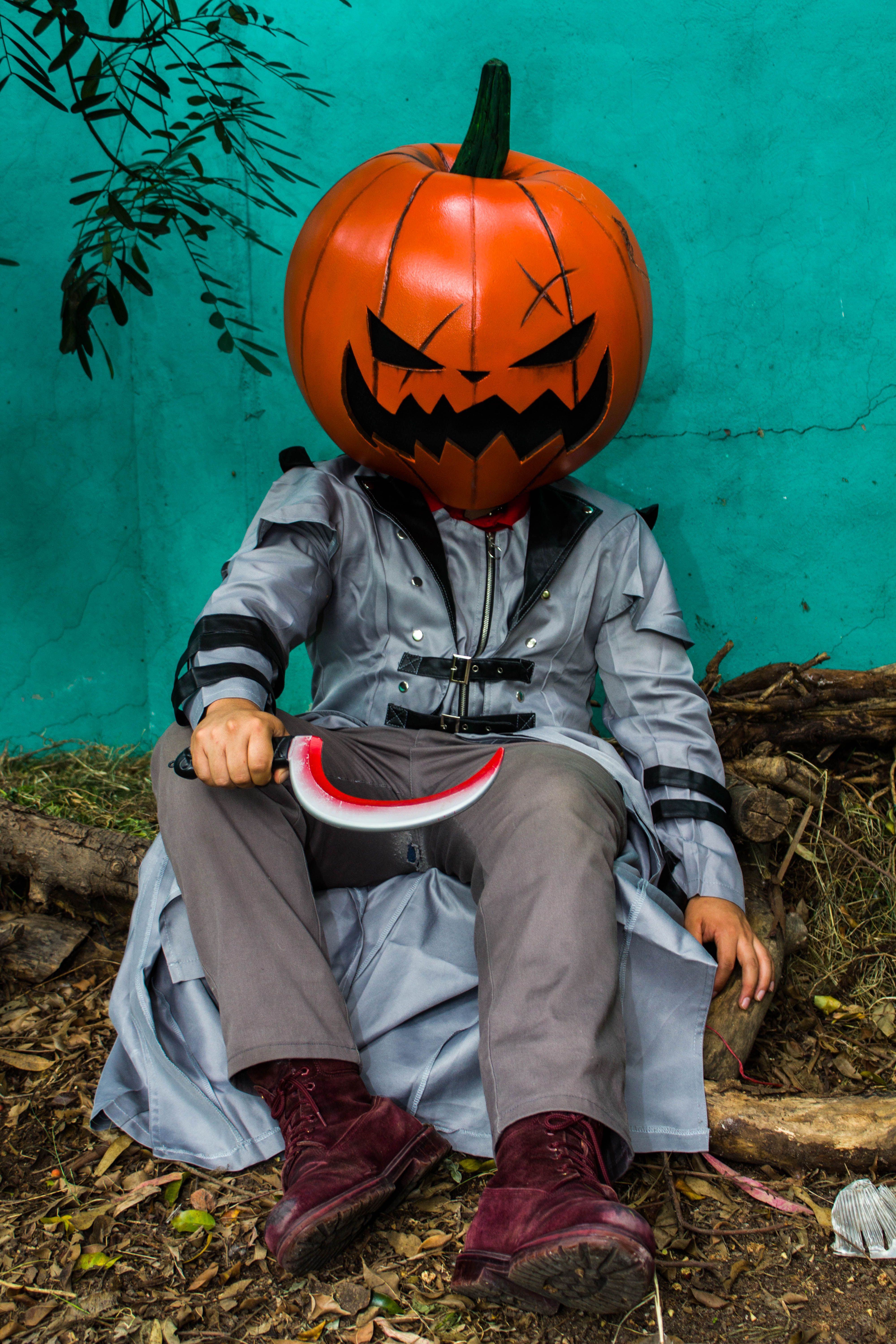 Halloween Pumpkinhead Costume with Knife Outdoors