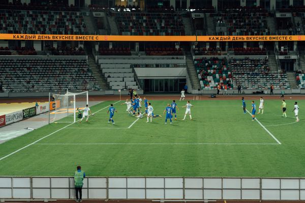 Football match in a modern stadium