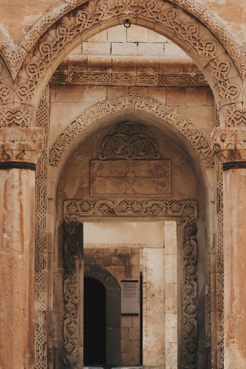 Free Intricate stone archway showcasing ancient architectural craftsmanship. Stock Photo