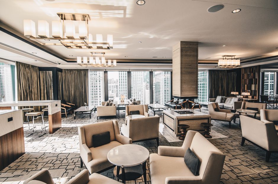 Luxurious hotel lobby featuring custom hotel furniture wholesale pieces, inviting guests with elegant design.