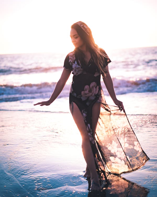 Free Photo Of Woman Walking On Seashore Stock Photo