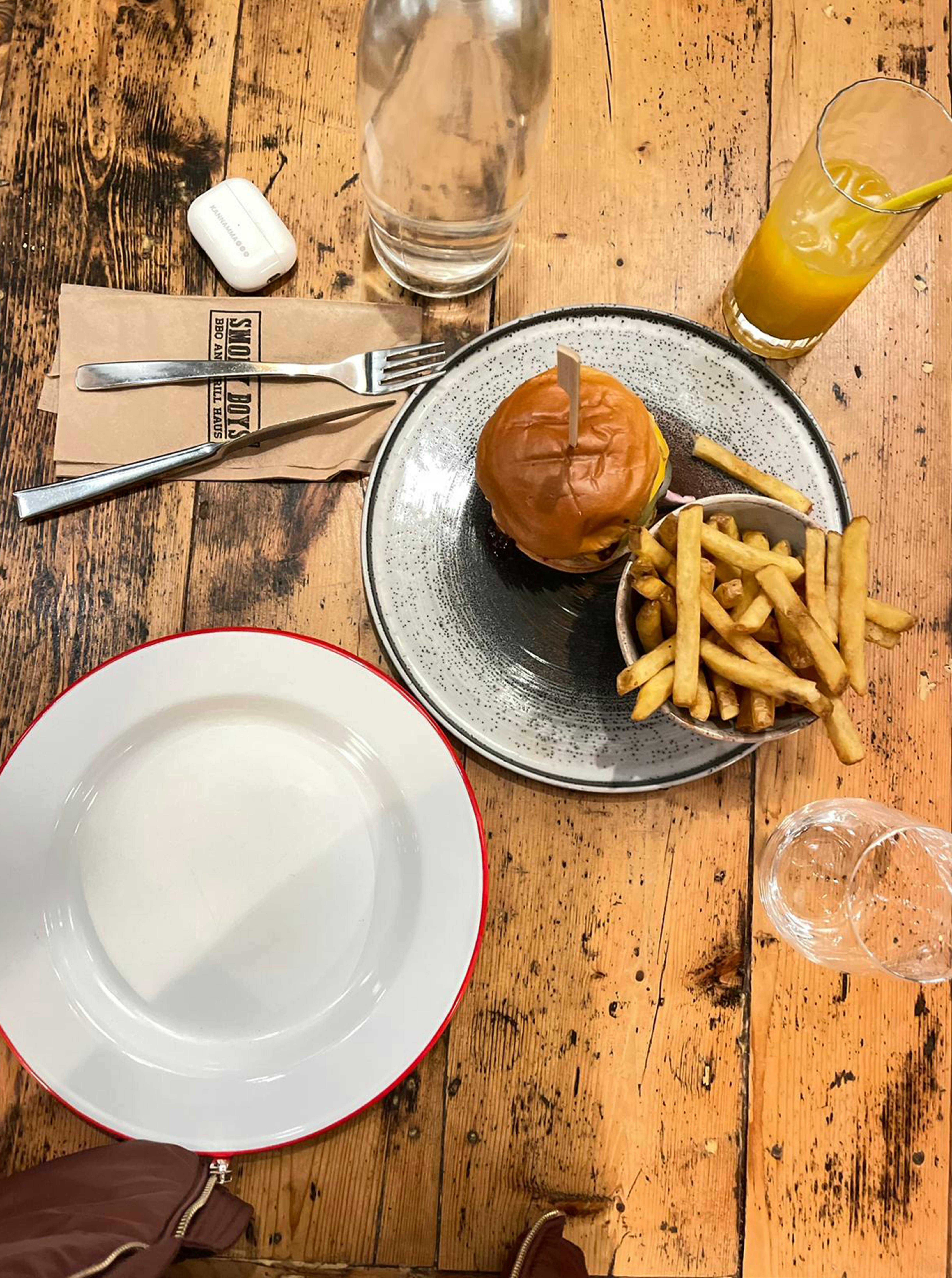 delicious burger and fries meal on rustic table